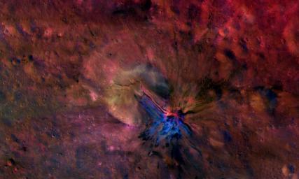 This colorful composite image from NASA's Dawn mission shows the flow of material inside and outside a crater called Aelia on the giant asteroid Vesta. To the naked eye, these structures would not be seen. But here, they stand out in blue and red.