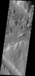 The surface textures located southeast of Aeolis Planum likely had wind action as one of the contributing processes, as shown by NASA's 2001 Mars Odyssey spacecraft.