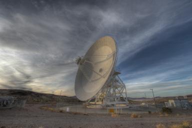 Goldstone's 111.5-foot (34-meter) Beam Waveguide tracks a spacecraft as it comes into view. The Goldstone Deep Space Communications Complex is located in the Mojave Desert in California, USA.