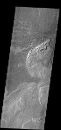 This image near Athabasca Valles shows thin plate of lava as seen by NASA's 2001 Mars Odyssey spacecraft. This style of lava flow is very different from other lava flows in the nearby Elysium and Tharsis volcanic complexes.
