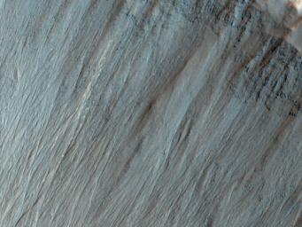 This image from NASA's Mars Reconnaissance Orbiter shows a well-preserved impact crater. A closeup view highlights distinctive bright lines and spots on the steep slope on the north side.