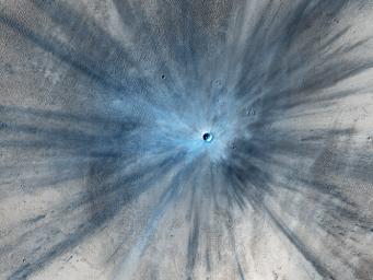 A dramatic, fresh impact crater dominates this image taken by the HiRISE camera onboard NASA's Mars Reconnaissance Orbiter on Nov. 19, 2013. The crater is surrounded by a large, rayed blast zone.