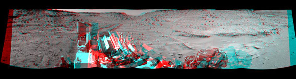 This stereo view combining images taken on Feb. 10, 2014, by the Navigation Camera (Navcam) on NASA's Curiosity Mars rover looks back to where the rover crossed a dune at 'Dingo Gap' four days earlier. You need 3D glasses to view this image.