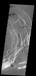 This image captured by NASA's 2001 Mars Odyssey spacecraft shows the eastern part of the complex caldera at the summit of Ascraeus Mons.