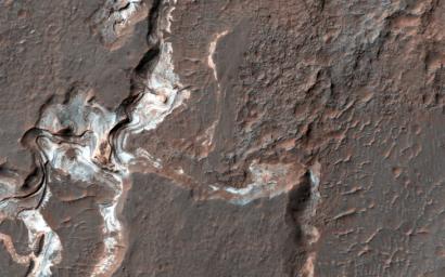 This image shows some bright layered deposits exposed within a linear trough along the floor of the Ladon Basin as seen by NASA's Mars Reconnaissance Orbiter.