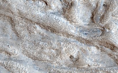 The objective of this observation from NASA's Mars Reconnaissance Orbiter is to determine the nature of a group of what appears to be channels that trend in a west-east direction.