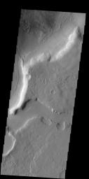 This image captured by NASA's 2001 Mars Odyssey spacecraft shows a portion of one of the numerous channels that dissect the northern margin of Arabia Terra.