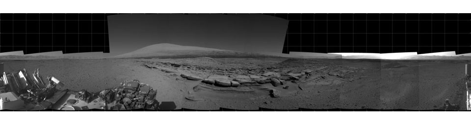 This view from NASA's Curiosity Mars rover spans 360 degrees, centered southward toward a planned science waypoint at 'the Kimberley,' with an outcrop of eroded sandstone in the foreground.