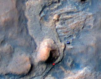 In this Mars Reconnaissance Orbiter view of the Curiosity rover mission's waypoint called 'the Kimberley,' the red dot indicates the location of a sandstone target, 'Windjana,' selected for close-up inspection.