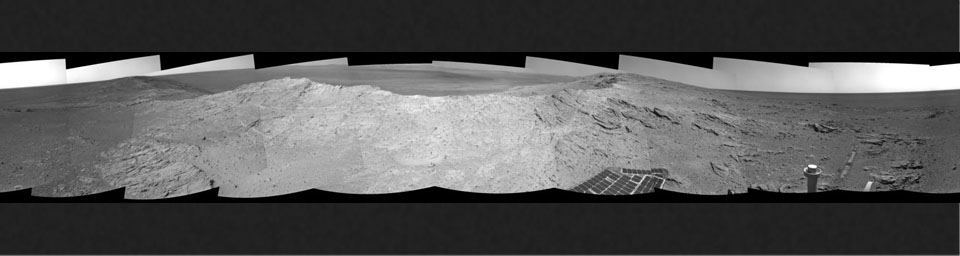 NASA's Mars Exploration Rover capturde this 360-degree view near the ridgeline of Endeavour Crater's western rim. The center is southeastward. Rocks on the slope to the right of center are in an outcrop area targeted for the rover to study.