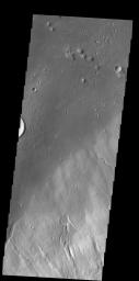 Multiple channels dissect the northwestern flank of Hecates Tholus in this image as seen by NASA's 2001 Mars Odyssey spacecraft.
