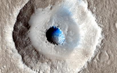 The crater in the center of this HiRISE image from NASA's Mars Reconnaissance Orbiter is unusual because there is a wide, flat bench, or terrace, between the outer rim and the inner section, making it appear somewhat like a bullseye.