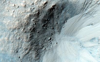 This impact crater in the region of Mars called Libya Montes, observed by NASA's Mars Reconnaissance Orbiter, shows typical gullies with alcoves at the top, channels, and depositional fans at the bottom.