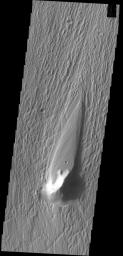 This image captured by NASA's 2001 Mars Odyssey spacecraft shows a streamlined island in Kasei Valles. The teardrop shape indicates that flow was from the bottom to the top of the image.