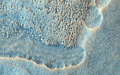 The objective of this observation by NASA's Mars Reconnaissance Orbiter was to examine the edge of impact ejecta from a crater to the north-west of this area (north is up, west is to the left).