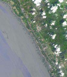 This image from NASA's Terra spacecraft shows the Bangladeshi coast north of Chittagong, where ships from around the world are beached and dismantled.