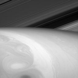 Nature is an artist, and this time she seems to have let her paints swirl together a bit. What the viewer might perceive to be Saturn's surface captured by NASA's Cassini orbiter is really just the tops of its uppermost cloud layers.