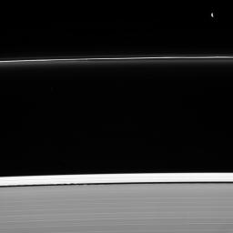 Two masters of their craft are caught at work shaping Saturn's rings captured by NASA's Cassini spacecraft. Pandora (upper right) sculpts the F ring. Meanwhile, Daphnis is busy holding open the Keeler gap (bottom center).