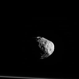 Janus seems to almost stare off into the distance, contemplating deep, moonish thoughts as the F ring stands by at the bottom of this image from NASA's Cassini spacecraft.
