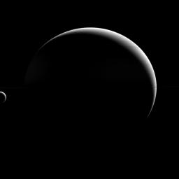Titan may be a 'large' moon -- its name even implies it -- but it is still dwarfed by its parent planet, Saturn. As it turns out, this is perfectly normal. This image is from NASA's Cassini spacecraft.