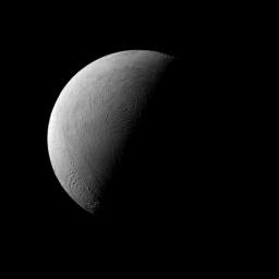 NASA's Cassini spacecraft captured this half-lit view of Saturn's moon Enceladus, whose icy surface is is uniformly bright, far brighter than Earth's moon.