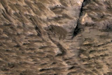 This April 6, 2014, image from NASA's Mars Reconnaissance Orbiter shows numerous landslides in the vicinity of where an impact crater was excavated in March 2012.