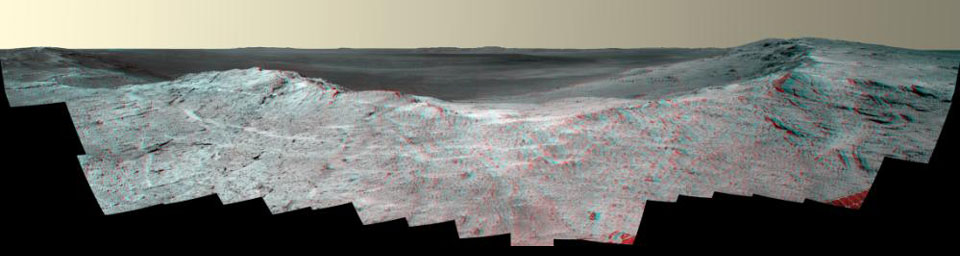 This stereo vista from the panoramic camera (Pancam) of NASA's Mars Exploration Rover Opportunity catches 'Pillinger Point,' on the western rim of Endeavour Crater, in the foreground. You need 3-D glasses to view this image.