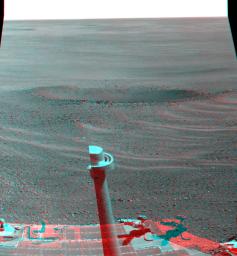 This stereo view from NASA's Opportunity rover shows 'Lunokhod 2 Crater,' which lies south of 'Solander Point' on the west rim of Endeavour Crater. Lunokhod 2 Crater is approximately 20 feet (6 meters) in diameter.