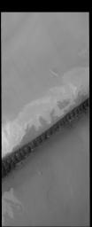 The dark, narrow band of sand dunes in this image from NASA's 2001 Mars Odyssey spacecraft is called Hyperboreae Undae.