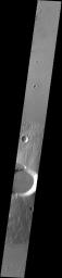 This image captured by NASA's 2001 Mars Odyssey spacecraft crosses the summit of Ceraunius Tholus.