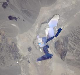 This image from NASA's Terra spacecraft shows the once-abandoned mining town of Silver Peak, Nevada, which began to thrive again when Foote Mineral Company began extracting lithium from brine below the floor of Clayton Valley in 1966.