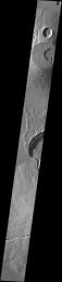 This image captured by NASA's 2001 Mars Odyssey spacecraft crosses the summit of Uranius Tholus, as well as the western flank of Ceraunius Tholus.