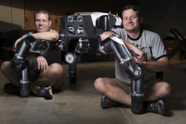 Limbed robot RoboSimian was developed at NASA's Jet Propulsion Laboratory, seen here with Brett Kennedy, supervisor of the JPL Robotic Vehicles and Manipulators Group, and Chuck Bergh, a senior engineer in JPL's Robotic Hardware Systems Group.
