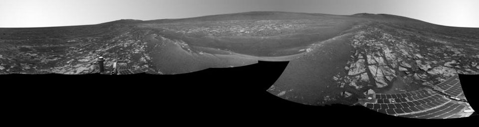 This July 29, 2014, panorama combines several images from the navigation camera on NASA's Mars Exploration Rover Opportunity to show the rover's surroundings after surpassing 25 miles (40.23 kilometers) of total driving on Mars.
