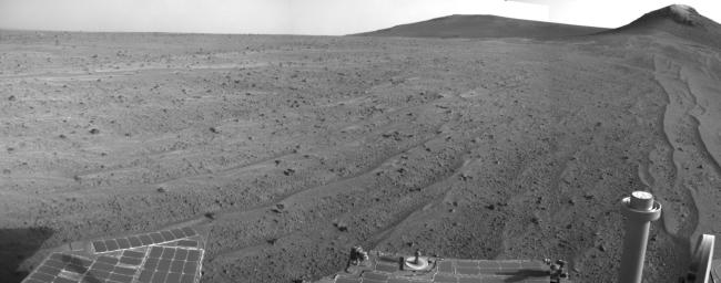 NASA's Mars rover Opportunity captured this view southward just after completing a 338-foot (103-meter) southward drive, in reverse, on Aug. 10, 2014. The foreground of this view from the rover's Navcam includes the rear portion of the rover's deck.