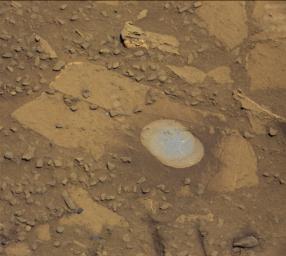 NASA's Curiosity Mars rover used the Dust Removal Tool on its robotic arm to brush aside reddish, more-oxidized dust, revealing a gray patch of less-oxidized rock material at a target called 'Bonanza King,' visible from the rover's Mastcam.