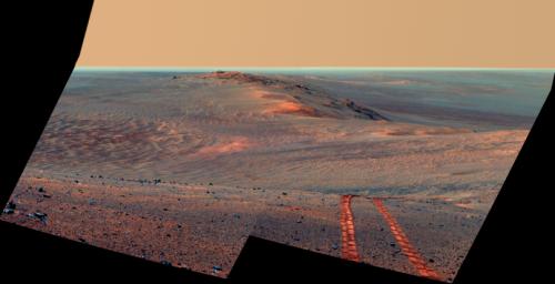 This false-color scene from the Pancam on NASA's Mars Exploration Rover Opportunity looks back toward part of the west rim of Endeavour Crater that the rover drove along, heading southward, during the summer of 2014.