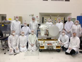 NASA's Optical PAyload for Lasercomm Science (OPALS) integration and test team is seen at NASA's Jet Propulsion Laboratory prior to OPALS shipment to Kennedy Space Center.