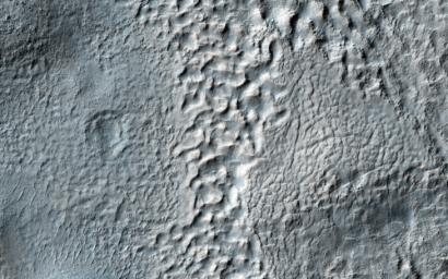 This mantle observed by NASA's Mars Reconnaissance Orbiter is thought to be deposited as snow during periods when the angle of the tilt of Mars' rotational axis-called obliquity-is much higher, which last happened around 10 million years ago.