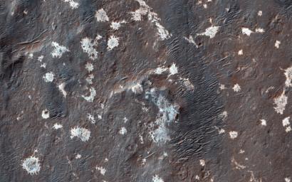 This image from NASA's Mars Reconnaissance Orbiter shows Vinogradov, an old, 224-kilometer diameter, heavily degraded impact crater in southern Margaritifer Terra.