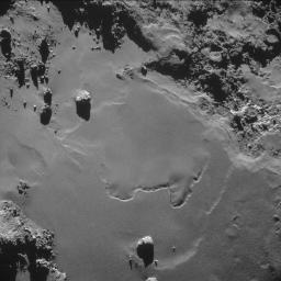 A patch of relatively smooth ground on the nucleus surface of comet 67P/Churyumov-Gerasimenko appears in this image taken by the navigation camera on the European Space Agency's Rosetta spacecraft in October 2014.