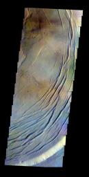 The THEMIS VIS camera contains 5 filters. The data from different filters can be combined to create a false color image. This false color image from NASA's 2001 Mars Odyssey spacecraft shows part of the caldera at the summit of Olympus Mons.