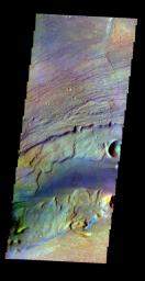 The THEMIS VIS camera contains 5 filters. The data from different filters can be combined in multiple ways to create a false color image. This false color image from NASA's 2001 Mars Odyssey spacecraft shows a portion of Kasei Vallis.
