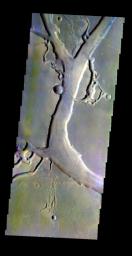 The THEMIS VIS camera contains 5 filters. The data from different filters can be combined in multiple ways to create a false color image. This false color image from NASA's 2001 Mars Odyssey spacecraft shows part of Granicus Valles.