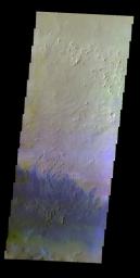 The THEMIS VIS camera contains 5 filters. The data from different filters can create a false color image. This false color image from NASA's 2001 Mars Odyssey spacecraft shows small dunes of the floor of Capen Crater in Terra Sabea.