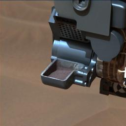 This image from NASA's Curiosity rover shows a sample of powdered rock extracted by the rover's drill from the 'Confidence Hills' target -- the first rock drilled after Curiosity reached the base of Mount Sharp in September 2014.