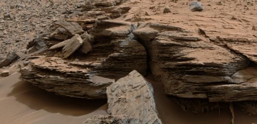 This view from the NASA's Curiosity Mars rover shows an example of cross-bedding that results from water passing over a loose bed of sediment. It was taken at a target called 'Whale Rock' within the 'Pahrump Hills' outcrop at the base of Mount Sharp.