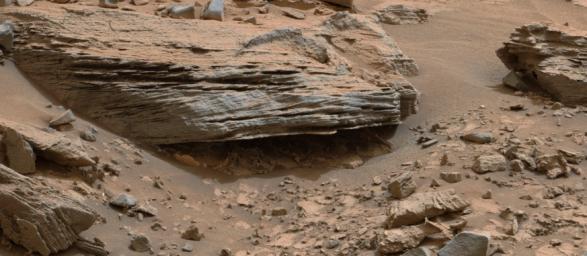 Cross-bedding seen in the layers of this Martian rock is evidence of movement of water recorded by the waves or ripples of loose sediment the water passed over, such as a current in a lake. This image is from NASA's Curiosity Mars rover.