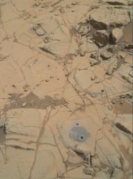 Gray cuttings from Curiosity's drilling into a target called 'Mojave 2' are visible surrounding the sample-collection hole in this image from NASA's Curiosity rover.