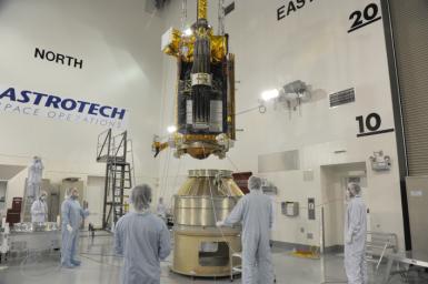 NASA's Soil Moisture Active Passive spacecraft is lowered onto the Delta II payload attach structure in the Astrotech payload processing facility at Vandenberg Air Force Base, California, in preparation for launch, to take place no sooner than Jan. 29.